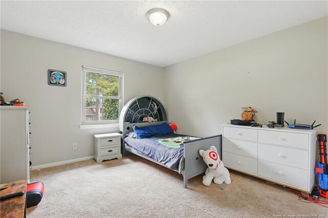 3511 Rolls Ave, Fayetteville, NC 28311 - bedroom with light carpet and baseboards