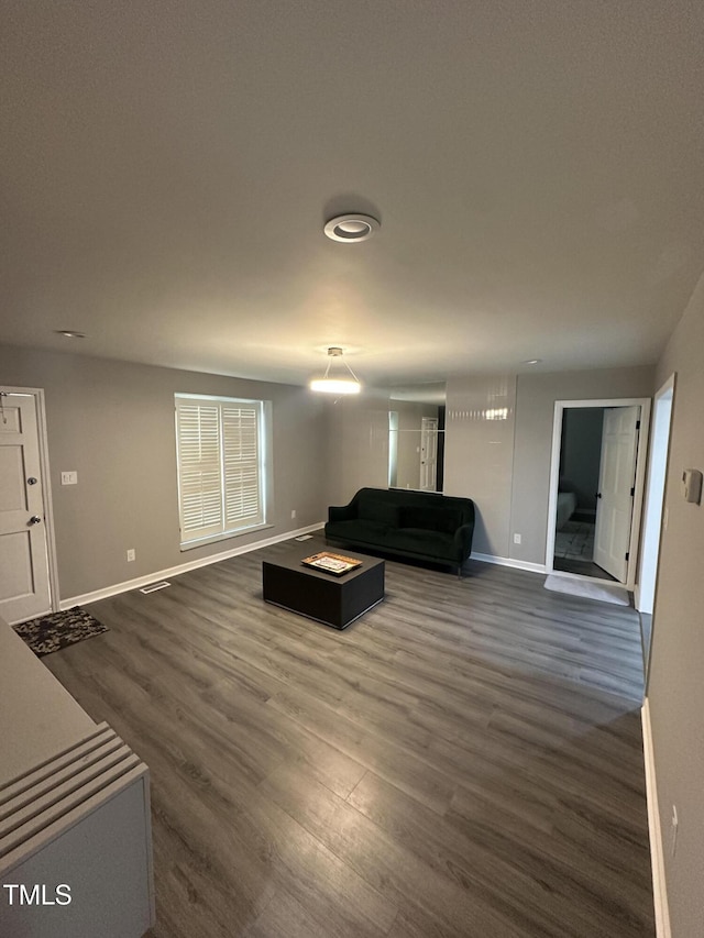 5809 Iris Lake Ct, Raleigh, NC 27604 - living area with baseboards and dark wood finished floors