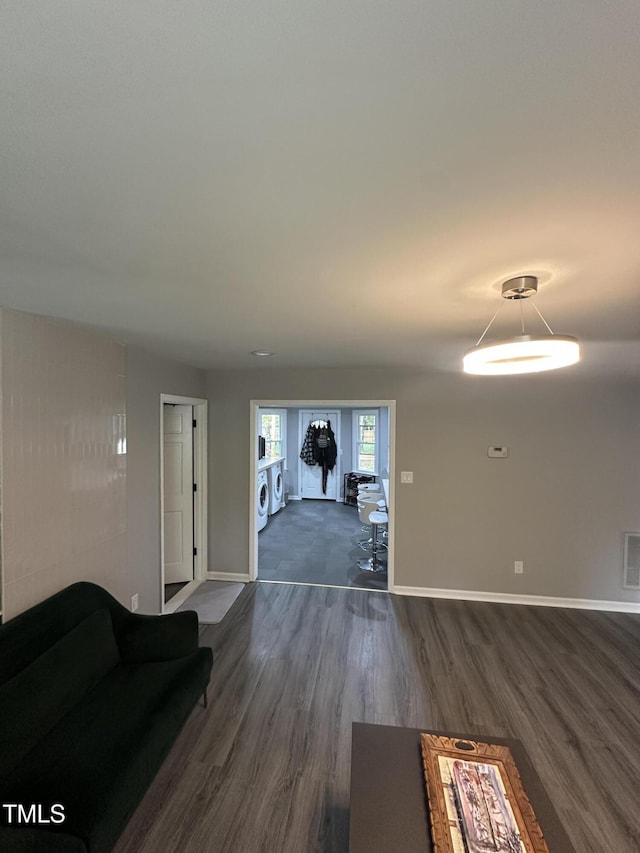 5809 Iris Lake Ct, Raleigh, NC 27604 - unfurnished living room featuring dark wood-style flooring and baseboards