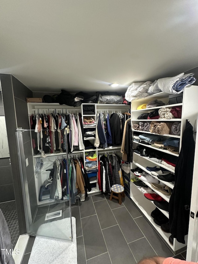5809 Iris Lake Ct, Raleigh, NC 27604 - spacious closet featuring dark tile patterned flooring