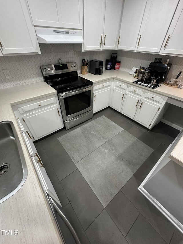 5809 Iris Lake Ct, Raleigh, NC 27604 - kitchen featuring electric range, under cabinet range hood, white cabinets, light countertops, and decorative backsplash