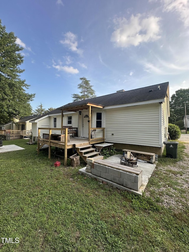 5809 Iris Lake Ct, Raleigh, NC 27604 - rear view of property featuring a wooden deck, a lawn, and a patio area