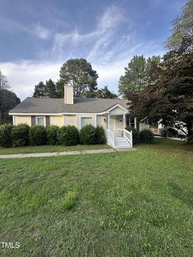 5809 Iris Lake Ct, Raleigh, NC 27604 - view of front of property with a front yard, a porch, and a chimney