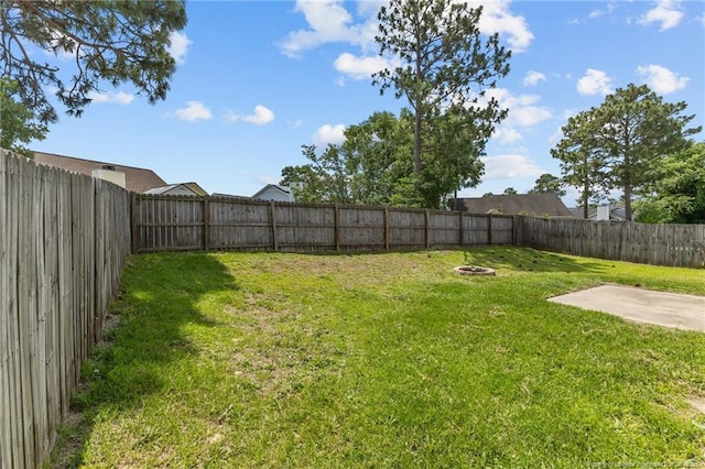 3117 Winesap Rd, Hope Mills, NC 28348 - fenced backyard with a patio and a fire pit