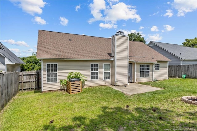 3117 Winesap Rd, Hope Mills, NC 28348 - rear view of property with a fenced backyard, a patio, and a chimney