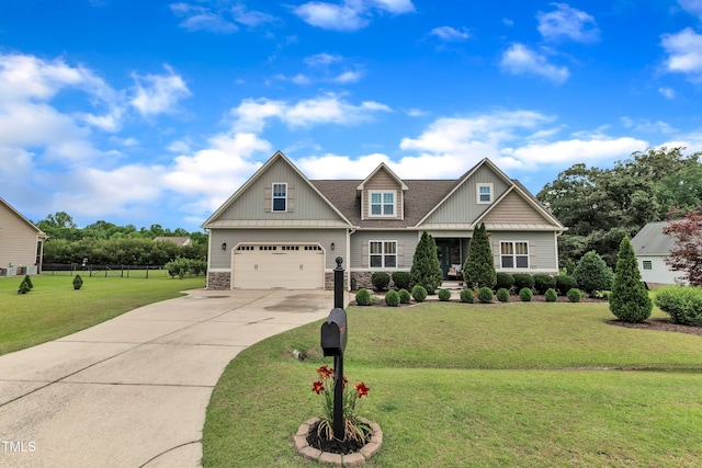 71 Smithsanders Ct, Smithfield, NC 27577 - craftsman inspired home featuring stone siding, driveway, an attached garage, and a front lawn