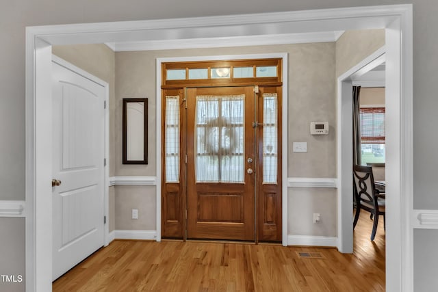 71 Smithsanders Ct, Smithfield, NC 27577 - foyer entrance featuring light wood-style floors and crown molding