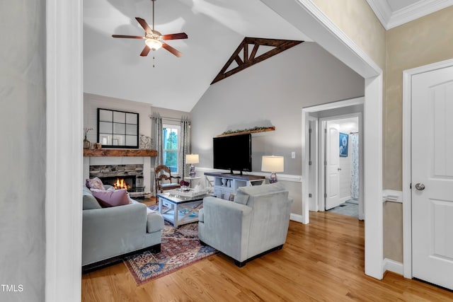 71 Smithsanders Ct, Smithfield, NC 27577 - living room featuring a stone fireplace, ceiling fan, wood finished floors, and high vaulted ceiling