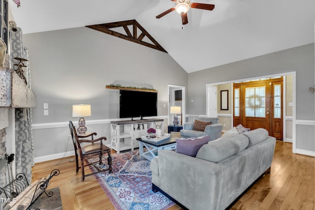 71 Smithsanders Ct, Smithfield, NC 27577 - living area featuring a ceiling fan, wood finished floors, high vaulted ceiling, and a large fireplace