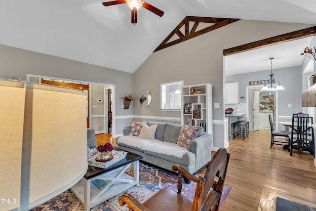 71 Smithsanders Ct, Smithfield, NC 27577 - living room with a ceiling fan, light wood finished floors, high vaulted ceiling, and a chandelier
