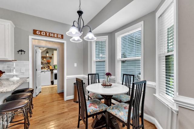 71 Smithsanders Ct, Smithfield, NC 27577 - dining area with light wood finished floors and a chandelier