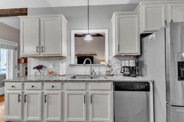 71 Smithsanders Ct, Smithfield, NC 27577 - kitchen featuring stainless steel appliances, white cabinetry, light stone countertops, and decorative light fixtures
