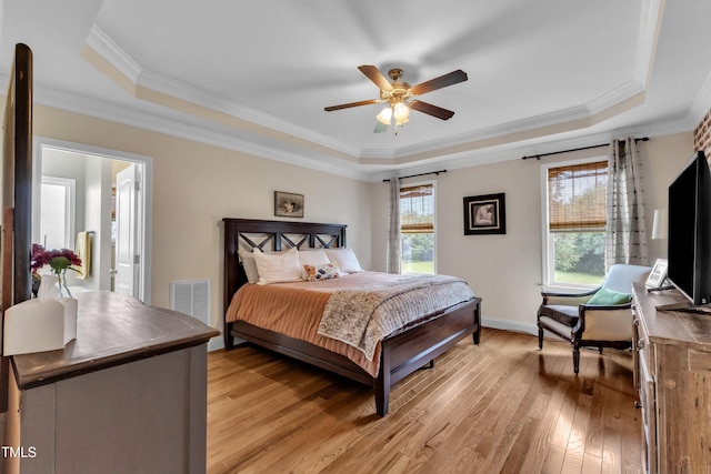 71 Smithsanders Ct, Smithfield, NC 27577 - bedroom featuring a tray ceiling, light wood-style floors, ornamental molding, and ceiling fan