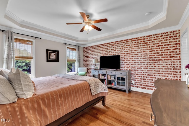 71 Smithsanders Ct, Smithfield, NC 27577 - bedroom with a raised ceiling, light wood finished floors, brick wall, crown molding, and ceiling fan