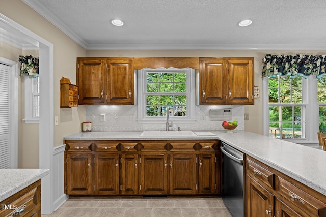 1304 Sandpiper Ct, Raleigh, NC 27615 - kitchen featuring stainless steel dishwasher, light countertops, plenty of natural light, crown molding, and a textured ceiling