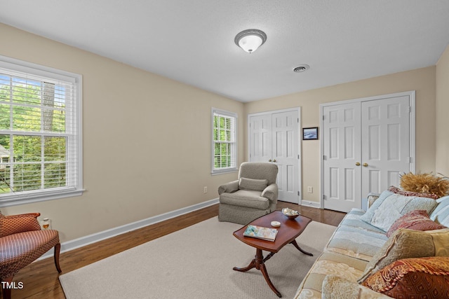1304 Sandpiper Ct, Raleigh, NC 27615 - living area featuring plenty of natural light and wood finished floors