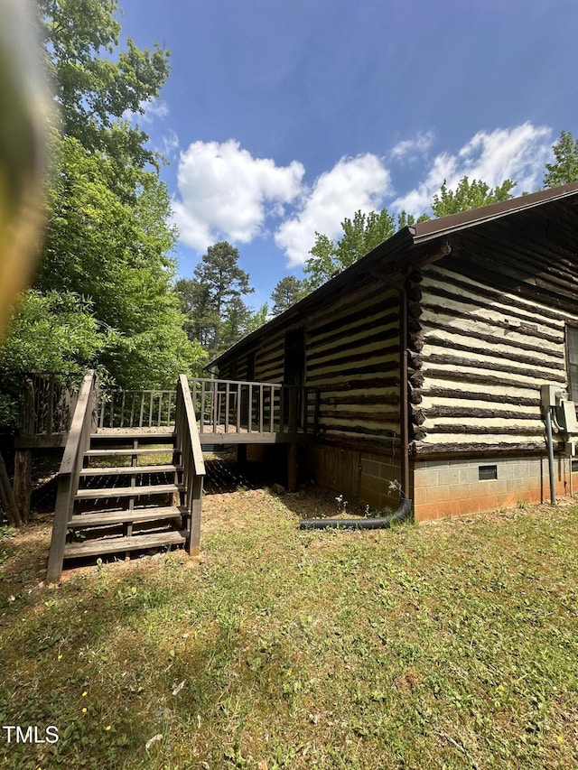 2011 Bowmantown Rd, Roxboro, NC 27574 - view of side of home featuring crawl space, a wooden deck, log exterior, and stairway