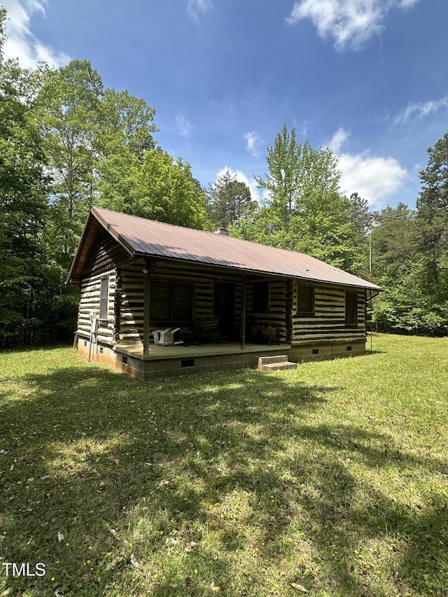 2011 Bowmantown Rd, Roxboro, NC 27574 - view of front of house with log exterior, crawl space, a front lawn, and a metal roof