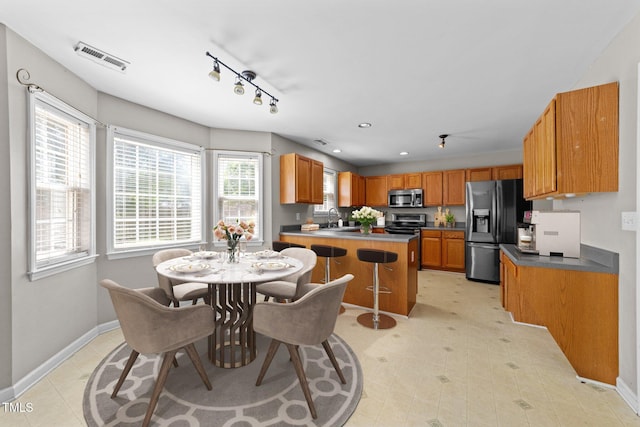 2037 Summer Shire Way, Raleigh, NC 27604 - dining area with rail lighting, recessed lighting, and light tile patterned floors