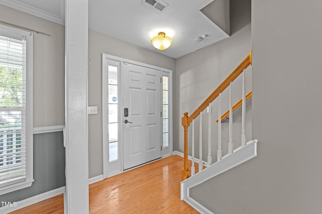 2037 Summer Shire Way, Raleigh, NC 27604 - foyer entrance with wood finished floors, stairs, and ornamental molding