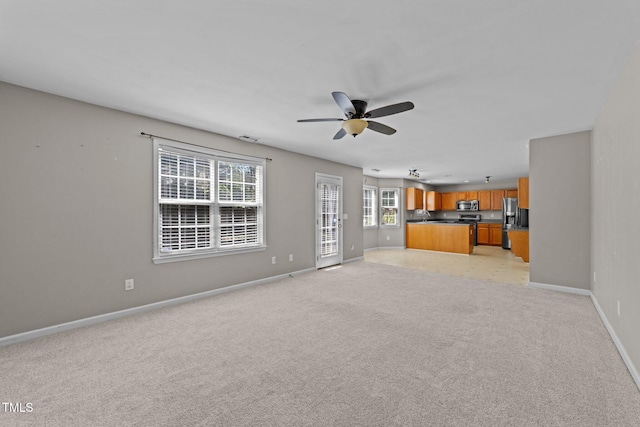 2037 Summer Shire Way, Raleigh, NC 27604 - unfurnished living room with ceiling fan and light colored carpet