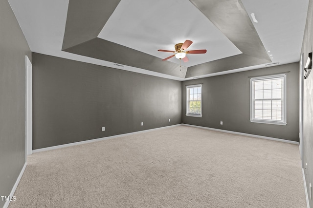2037 Summer Shire Way, Raleigh, NC 27604 - empty room featuring a tray ceiling, ceiling fan, and carpet flooring