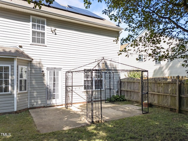 2037 Summer Shire Way, Raleigh, NC 27604 - back of property with a gazebo, a fenced backyard, solar panels, and a patio