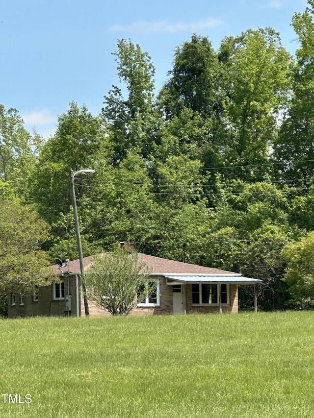 414/360 Woodsdale Rd, Roxboro, NC 27574 - view of front facade featuring a front yard