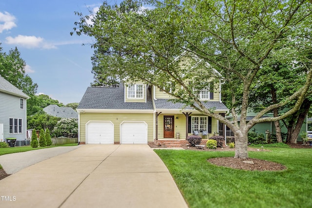 2218 Watersglen Dr, Apex, NC 27502 - view of front facade with driveway, a porch, a front lawn, and roof with shingles