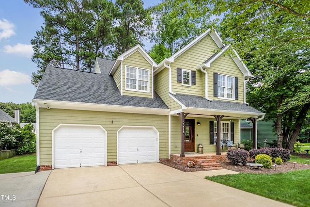 2218 Watersglen Dr, Apex, NC 27502 - traditional-style home with covered porch, concrete driveway, a shingled roof, and an attached garage