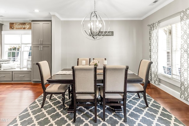 2218 Watersglen Dr, Apex, NC 27502 - dining area with a chandelier, plenty of natural light, ornamental molding, dark wood-type flooring, and recessed lighting