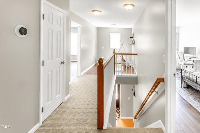 2218 Watersglen Dr, Apex, NC 27502 - corridor with an upstairs landing and wood finished floors