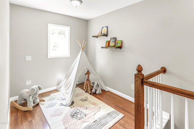 2218 Watersglen Dr, Apex, NC 27502 - recreation room with wood finished floors and baseboards