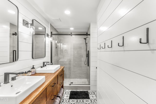2218 Watersglen Dr, Apex, NC 27502 - full bathroom with a shower stall, double vanity, recessed lighting, and tile patterned floors