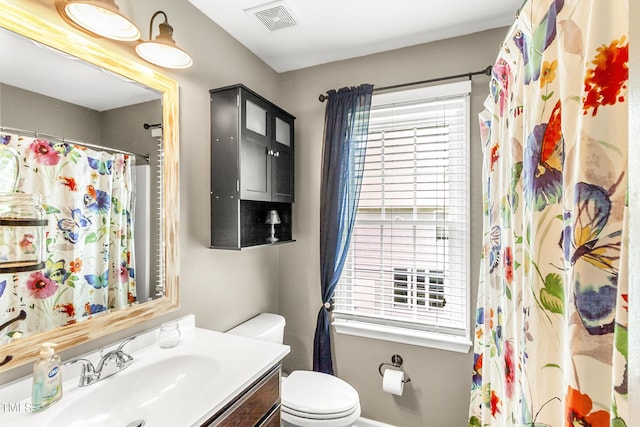 2218 Watersglen Dr, Apex, NC 27502 - full bathroom featuring vanity, plenty of natural light, and curtained shower