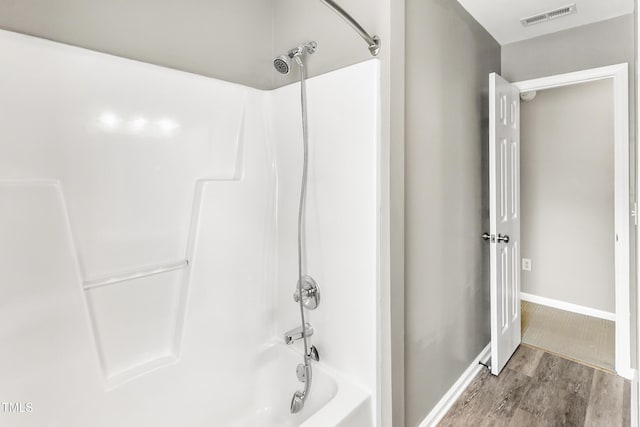2218 Watersglen Dr, Apex, NC 27502 - full bath featuring wood finished floors and shower / bathtub combination