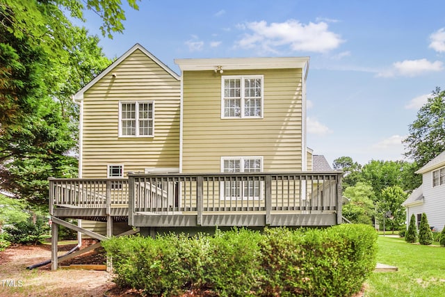 2218 Watersglen Dr, Apex, NC 27502 - rear view of property with a wooden deck and a yard