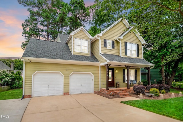 2218 Watersglen Dr, Apex, NC 27502 - traditional-style home featuring a porch, concrete driveway, roof with shingles, and a garage