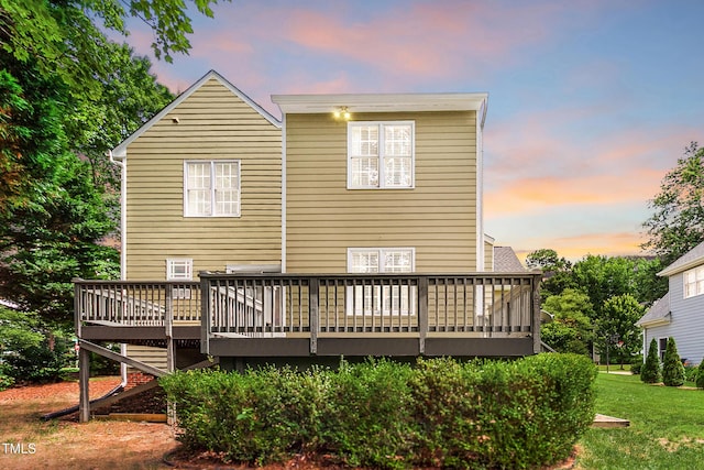 2218 Watersglen Dr, Apex, NC 27502 - back of property at dusk featuring a deck and a lawn