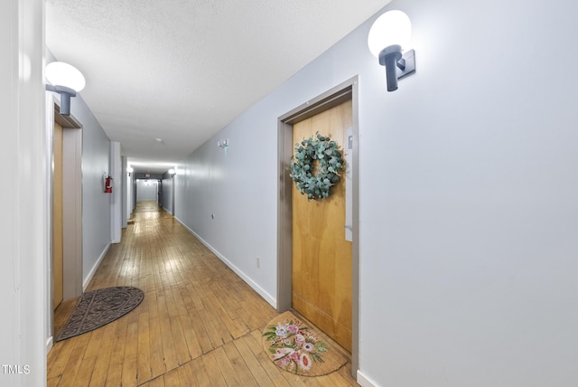 1500 River Mill Dr Unit 310, Wake Forest, NC 27587 - corridor with wood-type flooring and a textured ceiling