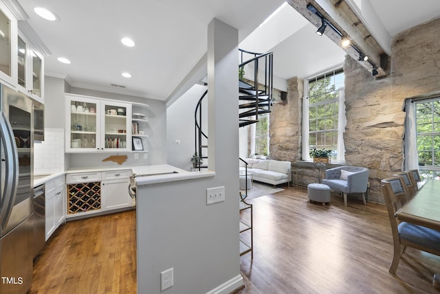 1500 River Mill Dr Unit 310, Wake Forest, NC 27587 - kitchen featuring wood finished floors, white cabinetry, crown molding, light countertops, and stainless steel appliances