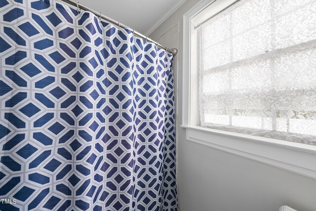 1500 River Mill Dr Unit 310, Wake Forest, NC 27587 - bathroom featuring a shower with shower curtain and ornamental molding