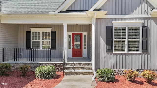 1013 Sagamore Dr, Louisburg, NC 27549 - doorway to property featuring board and batten siding, roof with shingles, and a porch