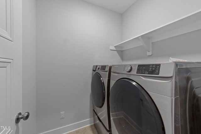 1013 Sagamore Dr, Louisburg, NC 27549 - washroom featuring washing machine and clothes dryer and baseboards