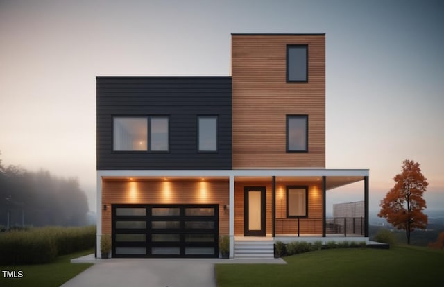 521 Coleman St, Raleigh, NC 27610 - modern home featuring covered porch, a front yard, and concrete driveway