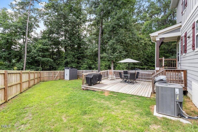 1304 Castlebay Rd, Durham, NC 27703 - fenced backyard with outdoor dining space, a wooden deck, and a shed