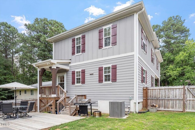 1304 Castlebay Rd, Durham, NC 27703 - rear view of property featuring board and batten siding and a wooden deck