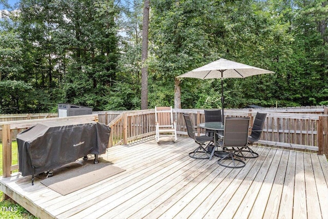 1304 Castlebay Rd, Durham, NC 27703 - wooden terrace with outdoor dining space, a fenced backyard, area for grilling, and a shed
