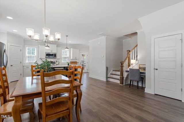1304 Castlebay Rd, Durham, NC 27703 - dining area with ornamental molding, stairs, dark wood-style floors, recessed lighting, and a chandelier