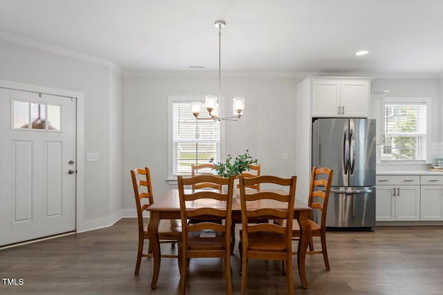 1304 Castlebay Rd, Durham, NC 27703 - dining space with a chandelier, dark wood finished floors, ornamental molding, and recessed lighting